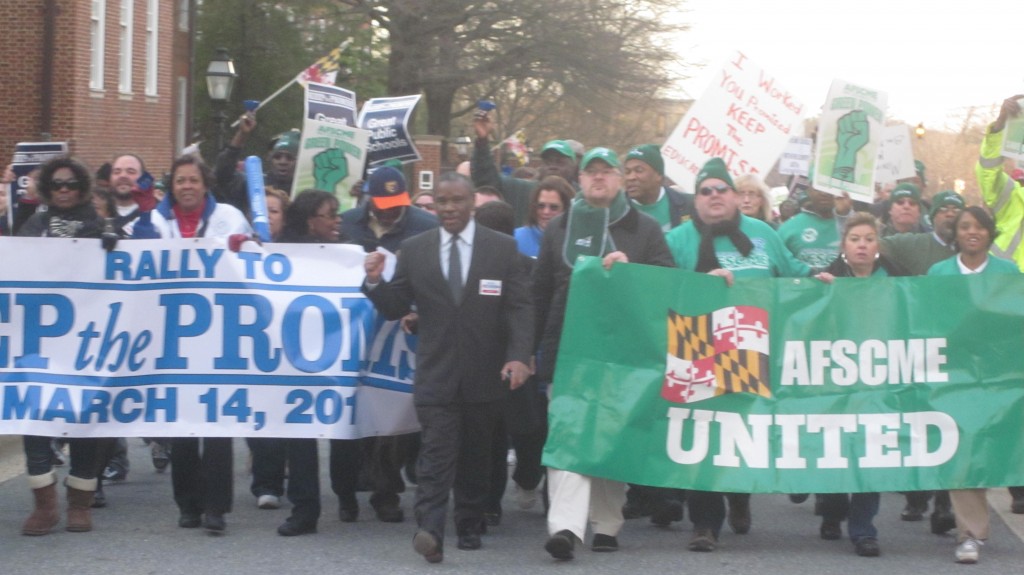Alvin Thornton (in suit) and union leaders head march to State House.