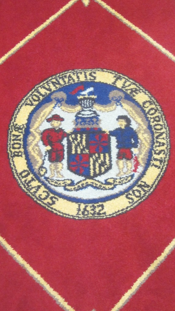 State seal on rug