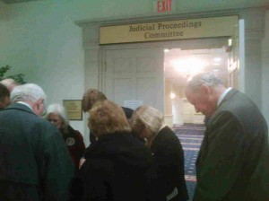 same-sex prayer Supporters of traditional marriage pray outside the Senate Judicial Proceedings hearing room.