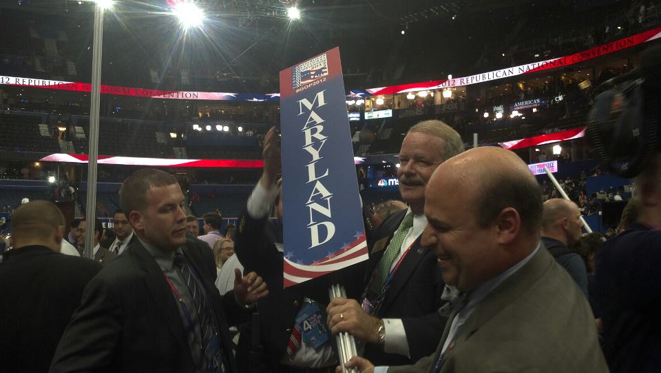 Maryland delegation chairman Louis Pope and Mike Pappas hold the Maryland floor sign.