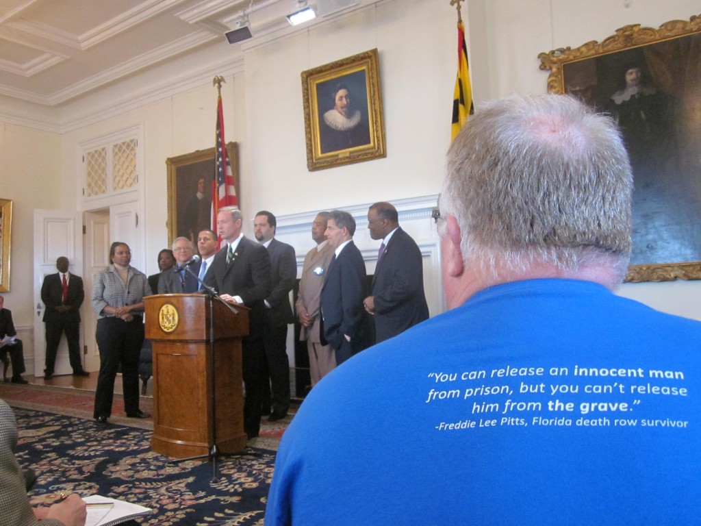 Kirk Bloodsworth, foreground, listens as Gov. Martin O’Malley talks about death penalty repeal.
