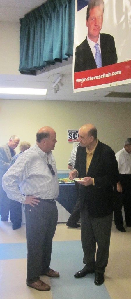 Former Anne Arundel County Executive John Leopold, right, talks with guest at Del. Steve Schuh's announcement. 
