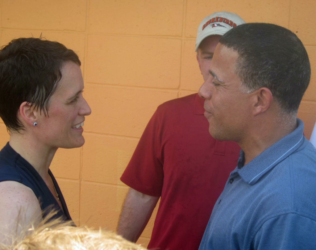 Democratic Lt. Gov. Anthony Brown greets Del. Heather Mizeur on the day she formally announced her campaign for governor, the same job he wants. Brown's running mate Ken Ulman, the Howard County executive, is in the background.
