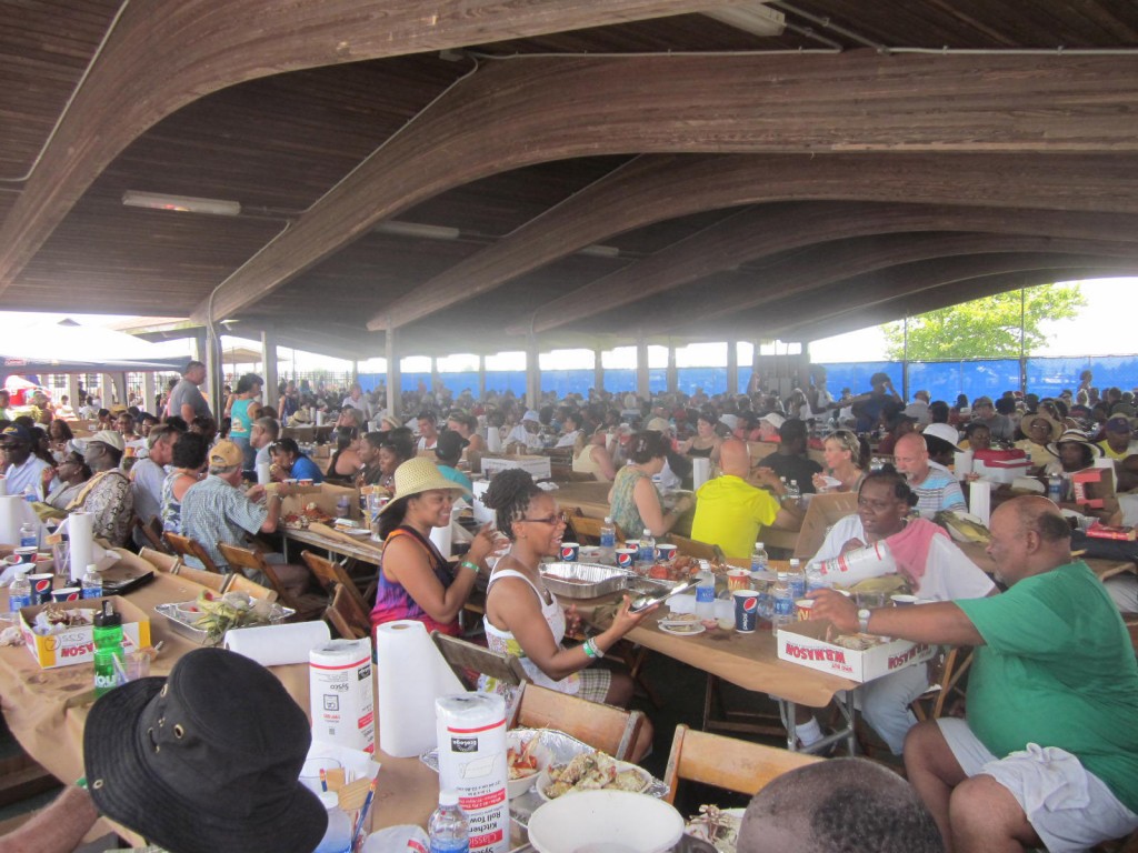 Thousands of regular people eat crabs, clams and corn in the main hall of the Somers Cove Marina.