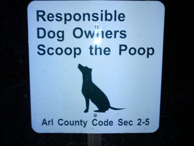Sign: Responsible Dog owners scoop the poop (By voteprime on Flickr)