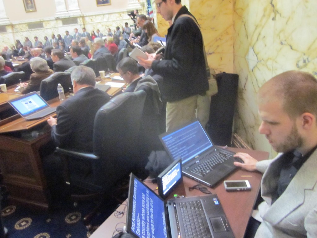 The telepompter operator in the back corner with reporters along the back wall. (MarylandReporter.com)