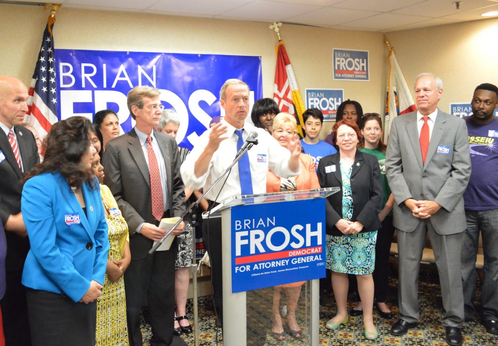Gov. Martin O'Malley at podium endorses Sen. Brian Frosh, left of governor, for attorney general, on surrounded by legislators from Montgomery and Prince George's counties and union members.