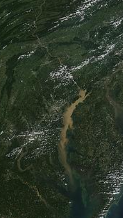 This satellite photo shows a plume of sil from 19 million tons of nutrient laden sediment spilled into the upper bay from Tropical Storm Lee, September 2011, four million tons was scoured from behind the Connowingo dam