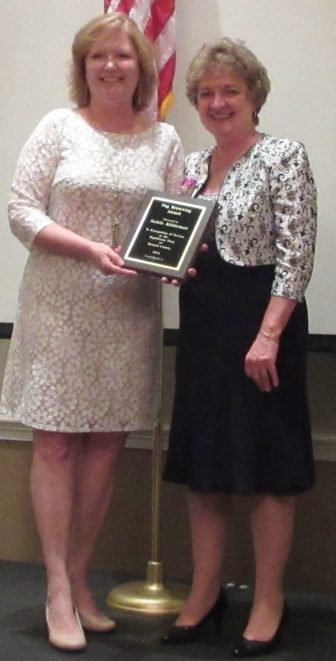 Robin KIttleman, wife ot the county executive, received Peg Browning Woman of the Year award from party chair Loretta Shields. 