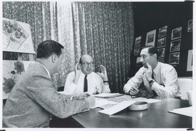 Jim Rouse, center, discusses plans for Columbia with lead designer Mort Hoppenfeld, right, and top manager Bill Finley. Photo by Robert de Gast, courtesy of Columbia Archives.