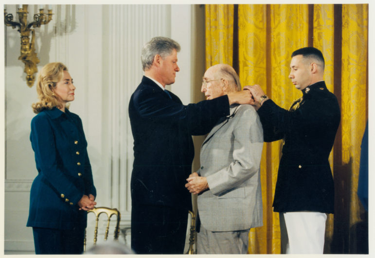 Jim Rouse is awarded the Medal of Freedom, the nation's highest civilian honor, by President Bill Clinton as Hillary Clinton looks on Sept. 28, 1995. Six months later Rouse died. White House photo, courtesy of Columbia Archives. 
