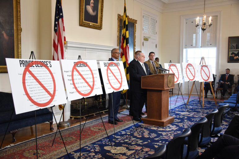 Gov. Larry Hogan presented charts of all the road projects he said would be killed by the transportation scoring law. Governor's Office photo. 