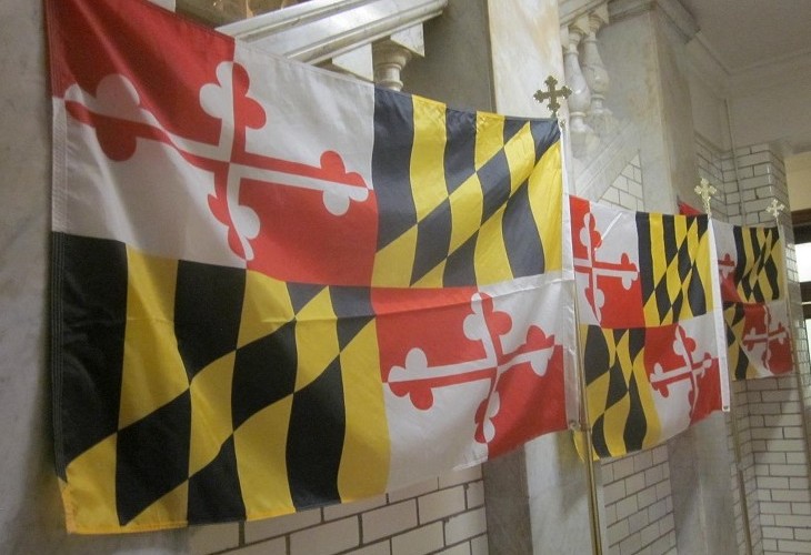 In a ground floor hallway of the State House, Maryland flags are readied for governor's State of the State address.