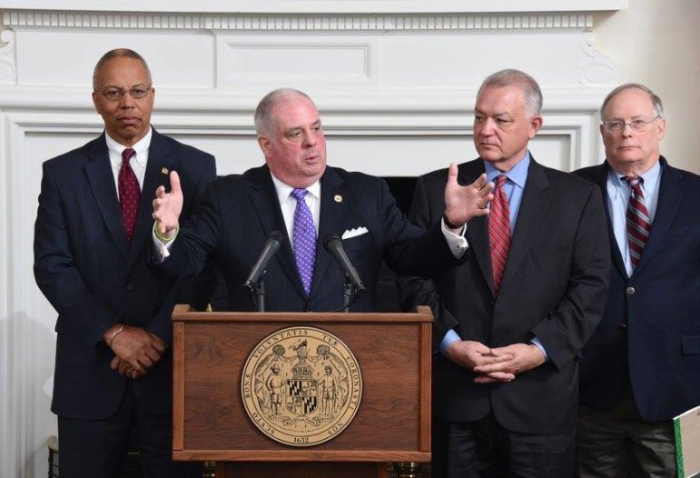 Gov. Larry Hogan explains his budget proposal at a Jan. 7 press conference. Left is Lt. Gov Boyd Rutherford, on the right is Budget Secretary David Brinkley and fiscal advisor Bob Neall.
