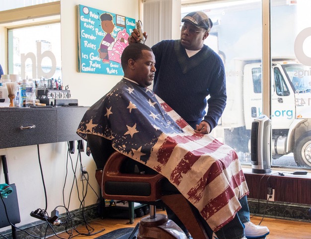 Troy Staton heads a network of barbers and beauticians helping clients cope with trauma in Baltimore in May 2020. He owns New Beginnings barbershop in Baltimore’s Hollins Market neighborhood. (Photo courtesy Troy Staton)