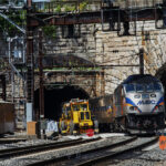 State Roundup: A neighborhood is shaken as Amtrak replaces 150-year-old tunnel; Ferguson says state has yet to feel impact of federal budget actions